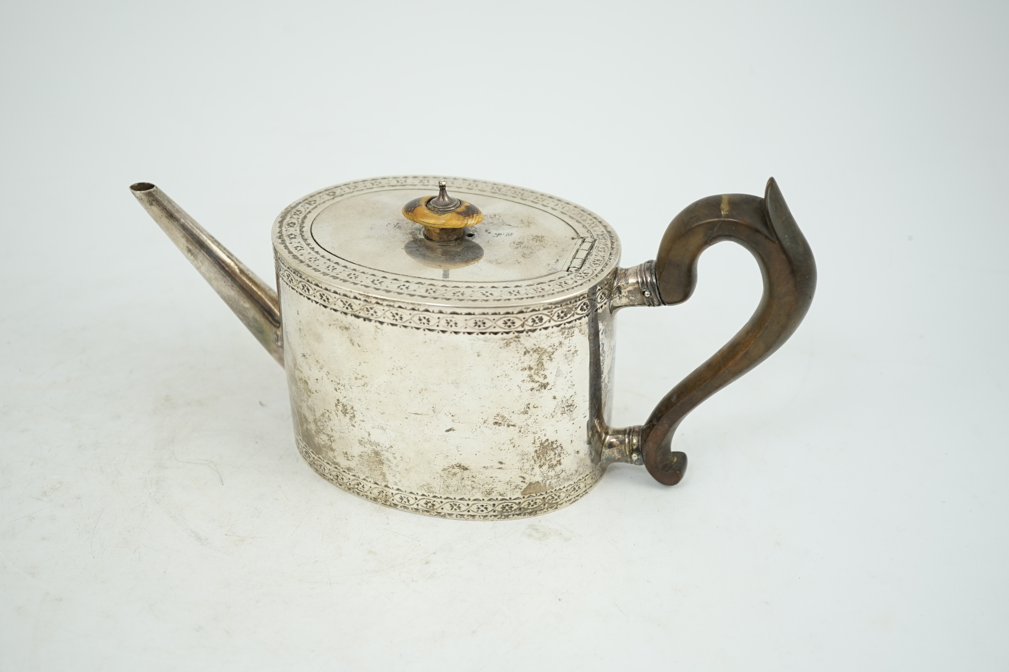 A George III engraved silver oval teapot, London, 1777, gross weight 16.5oz. CITES Submission reference KVNULT5X